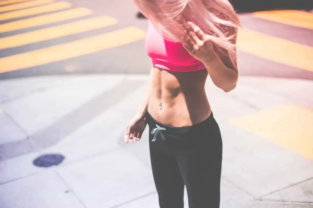 Woman with toned stomach after LA-EMS Body Sculpting Treatment Gerrards Cross