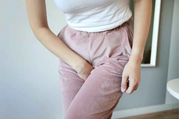 woman running for the toilet because of urinary incontinence Gerrards Cross